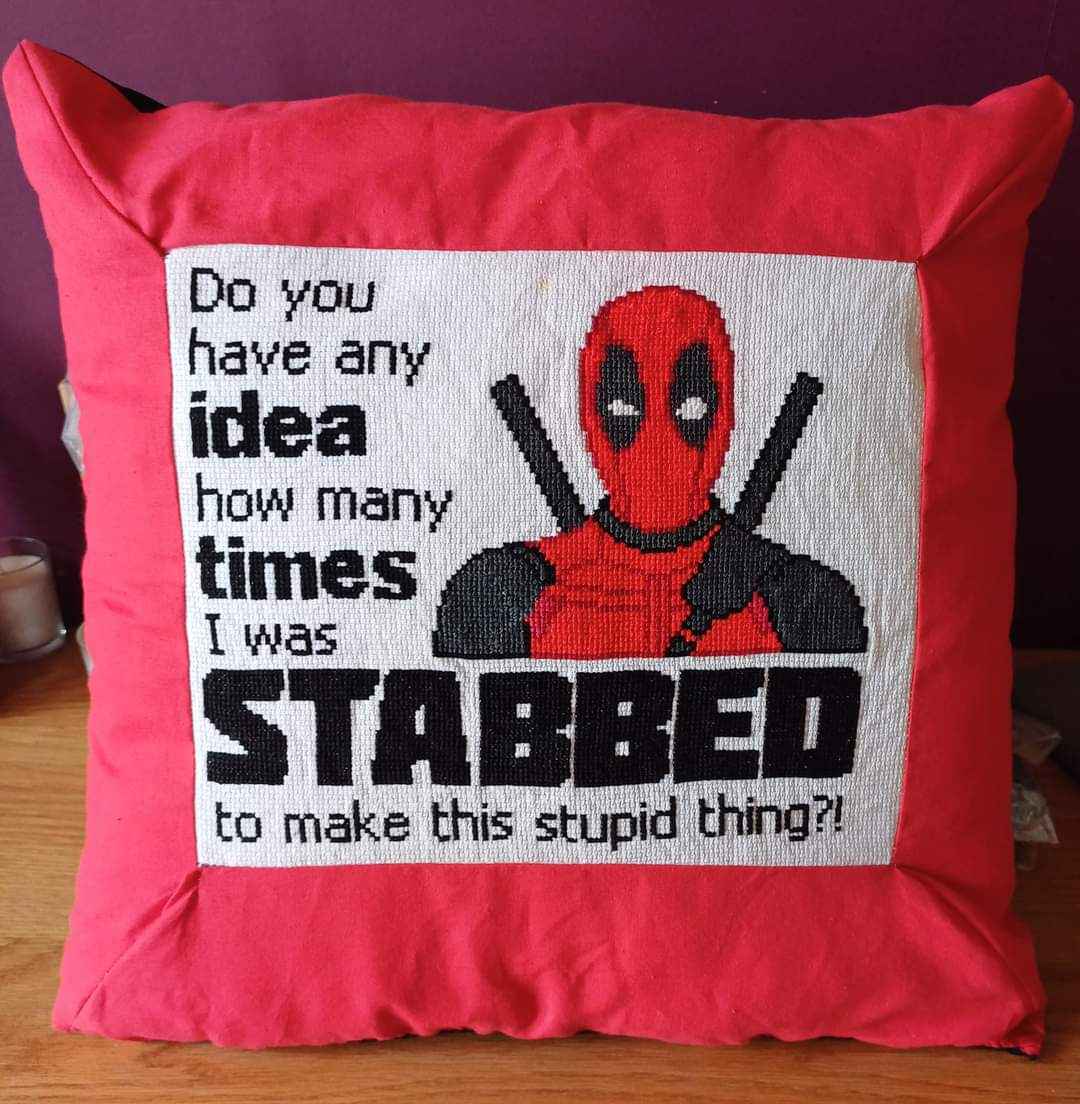 This pillow really leans into the Deadpool aesthetic, lol