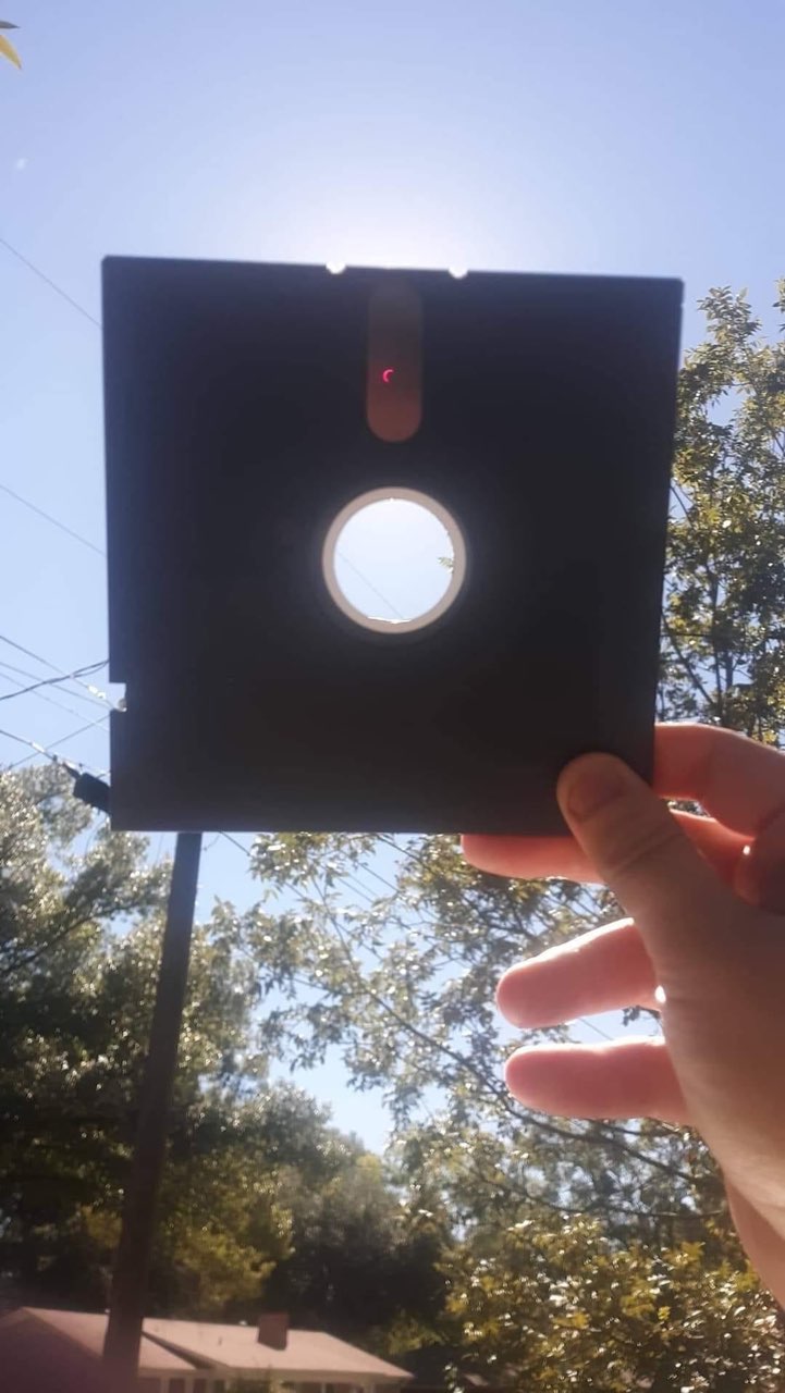 Improvise, adapt, overcome. Who needs eclipse glasses when you have a floppy disk?