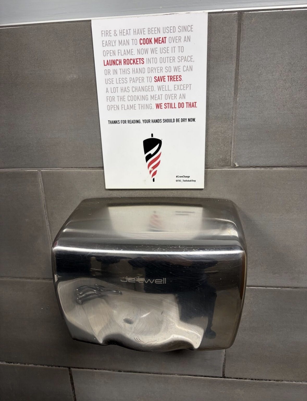 This sign is wild, apparently hand dryers are still used for cooking meat over an open flame