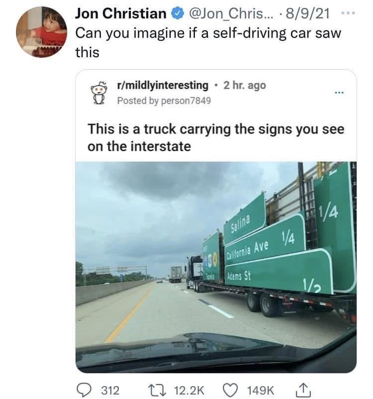 What happens when a self-driving car tries to navigate a road full of road signs being transported