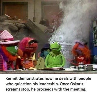 Kermit making sure everyone knows who's boss, even if it involves questionable methods.