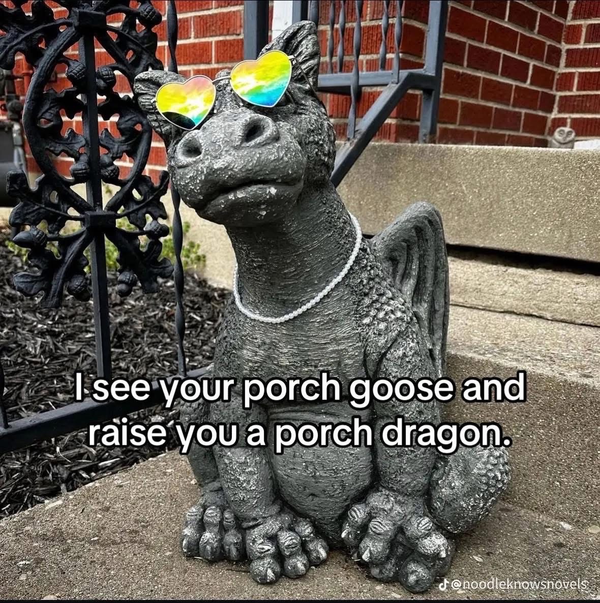 This porch dragon is definitely winning the neighborhood lawn ornament competition.
