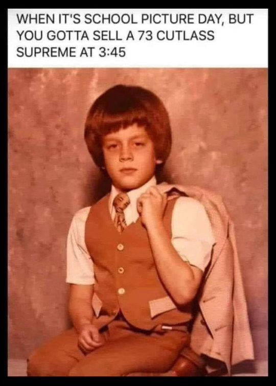 This kid is dressed for his school picture but also like he's about to close a big car deal.