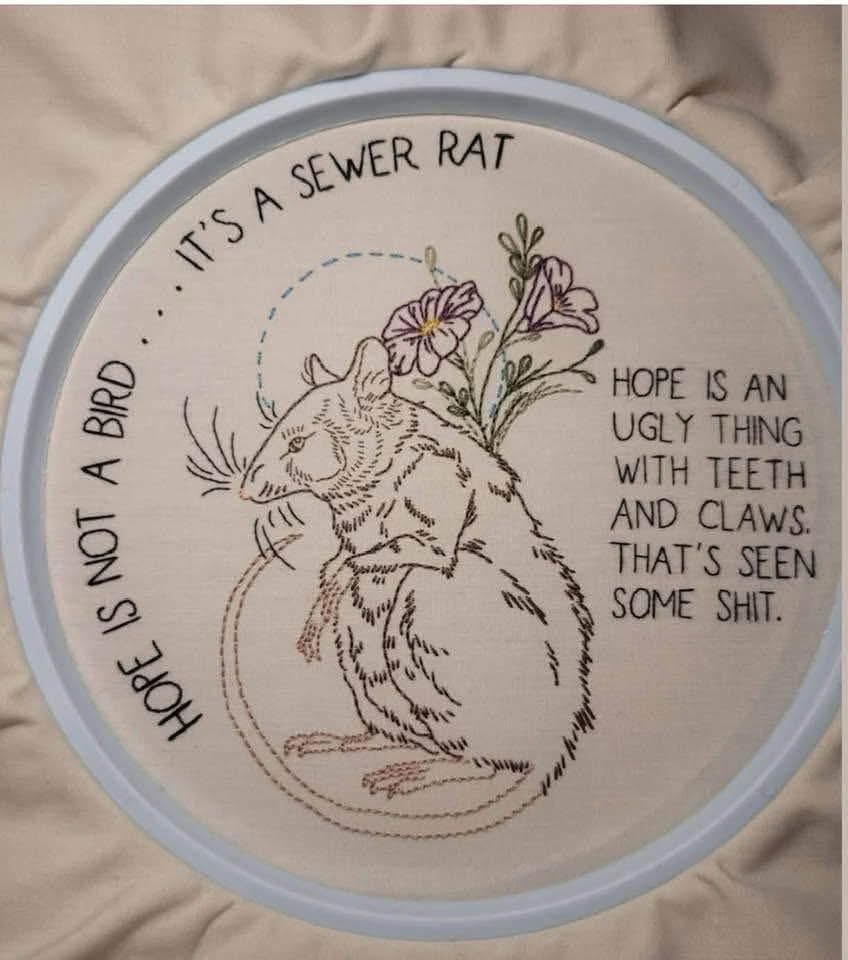 This embroidery perfectly captures that feeling of cynical hope that's seen some things.