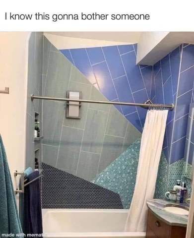 The infuriatingly asymmetrical tile job in this shower is causing me physical pain.
