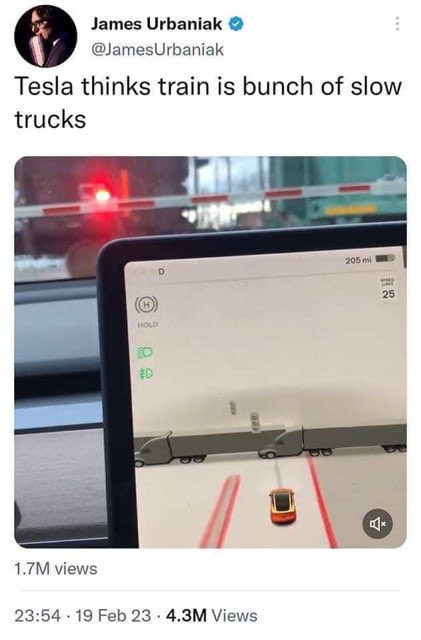 LMAO the Tesla's self-driving thinks a train is just a bunch of slow trucks