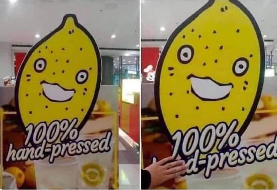 When you're told it's '100% hand-pressed' but a hand is literally touching the sign.